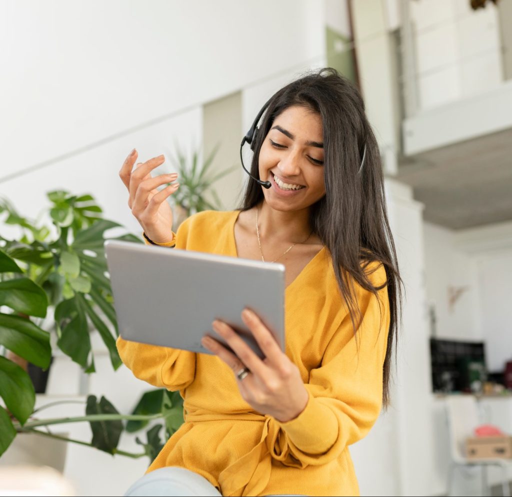 A business woman with a Bluetooth headset and an iPad